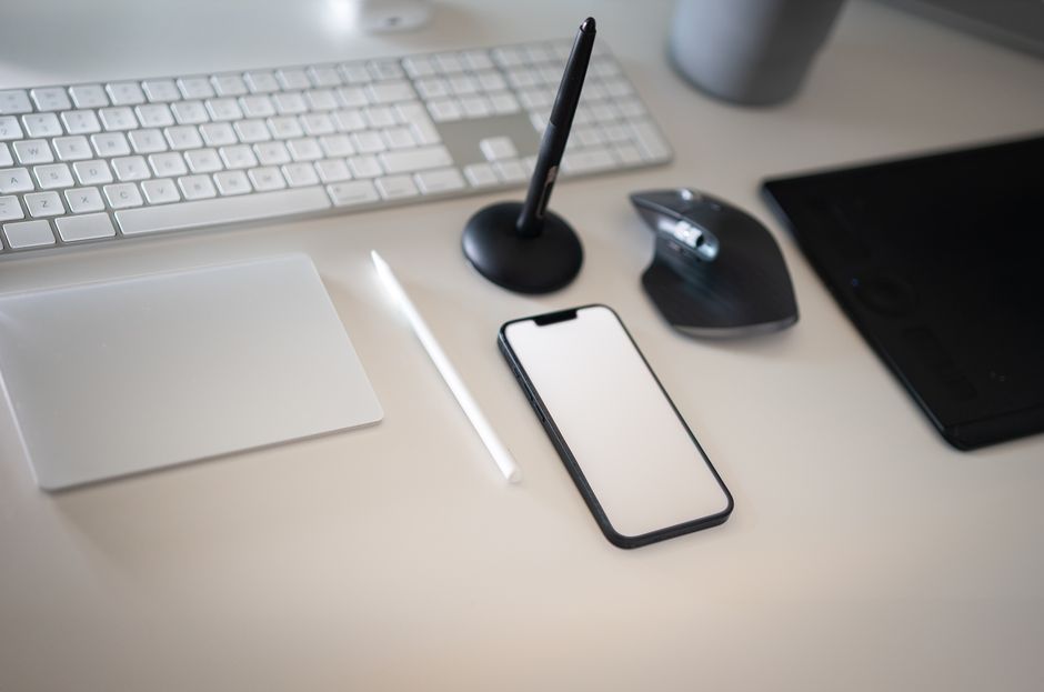 Clean and modern workspace featuring keyboard and smartphone