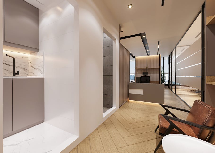 A stylish and contemporary office interior featuring marble and wood finishes.
